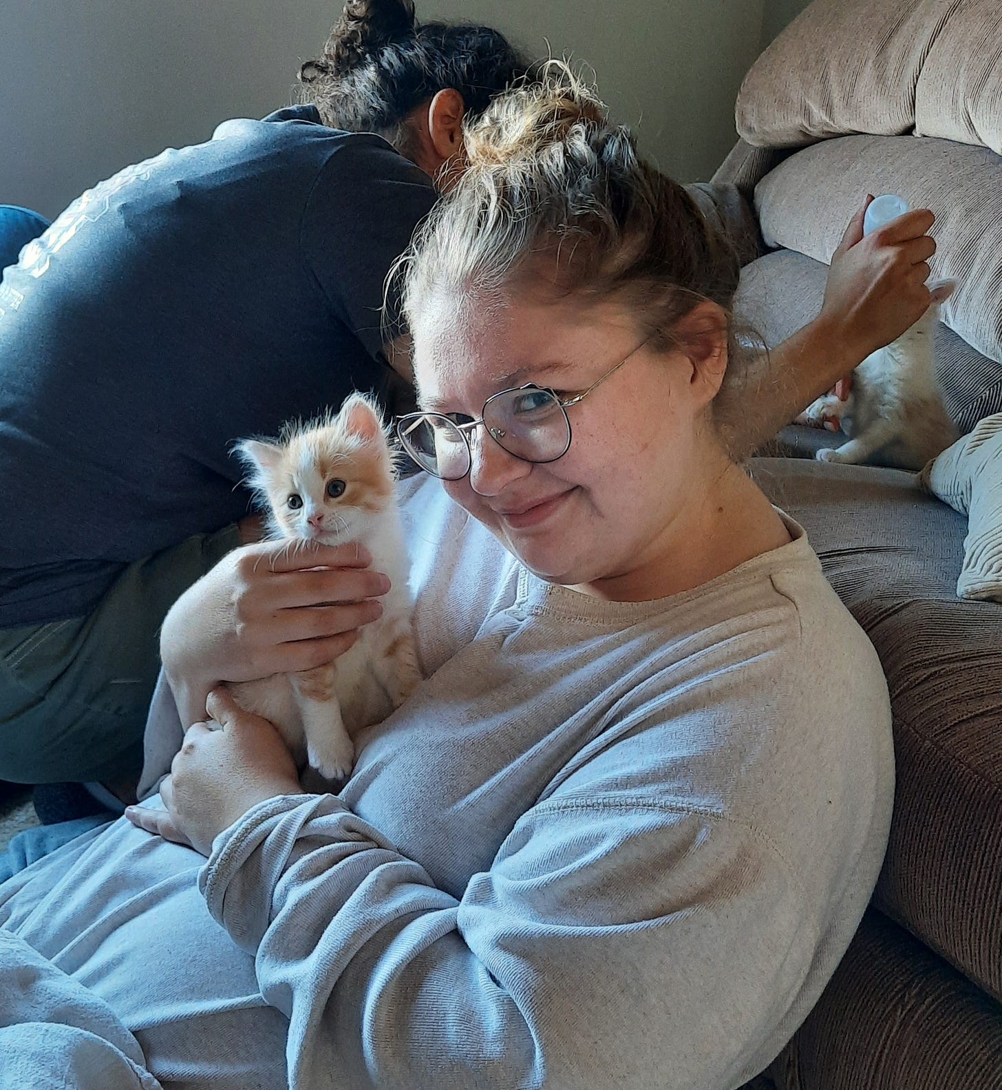 Amber smiling holding a kitten