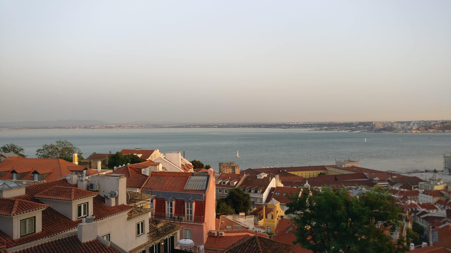 a view of the alfama neighborhood and the targus river from Lisbon's castle