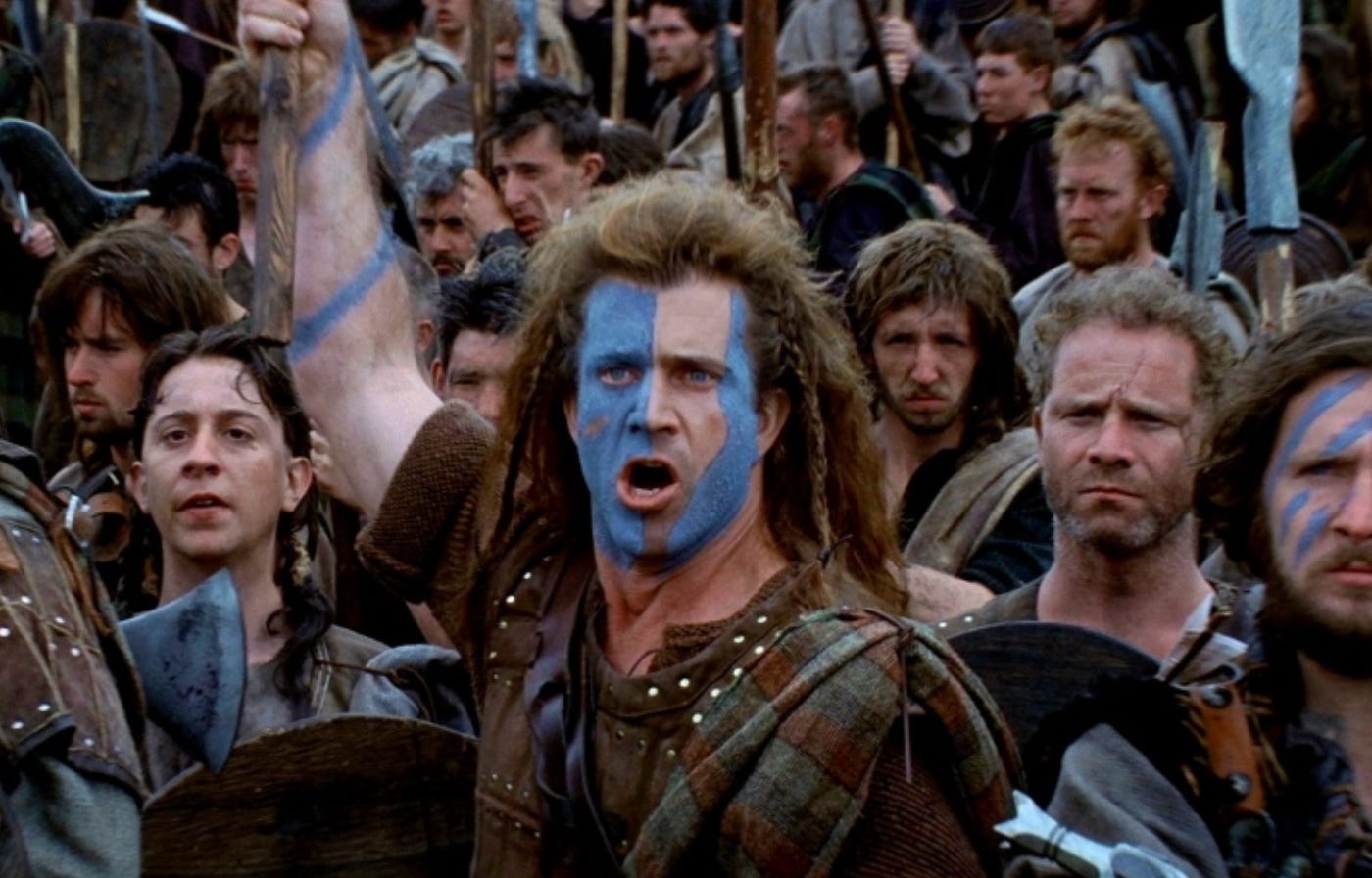 Mel Gibson in facepaint getting ready to battle in Braveheart