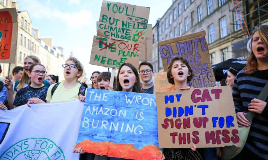 School students and activists take part in the Global Strike for Climate rally in Edinburgh. 