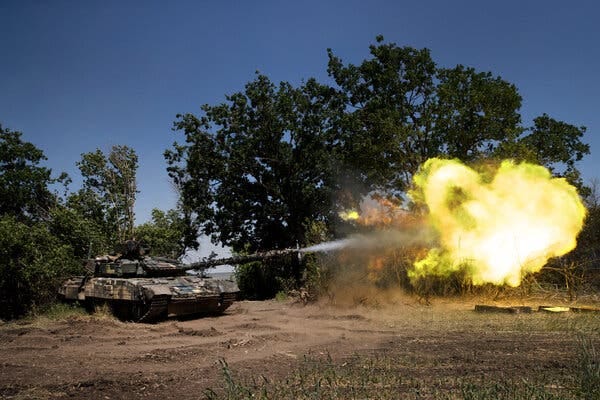 A Ukrainian tank firing at Russian positions on Friday in the Donetsk region of eastern Ukraine. Ammunition shortages are forcing troops to substitute tanks for howitzers.