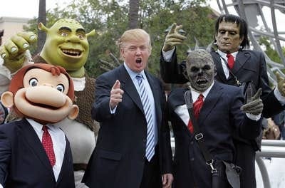 Donald Trump poses with Universal Studio characters at a casting call for his reality show The Apprentice in 2006.