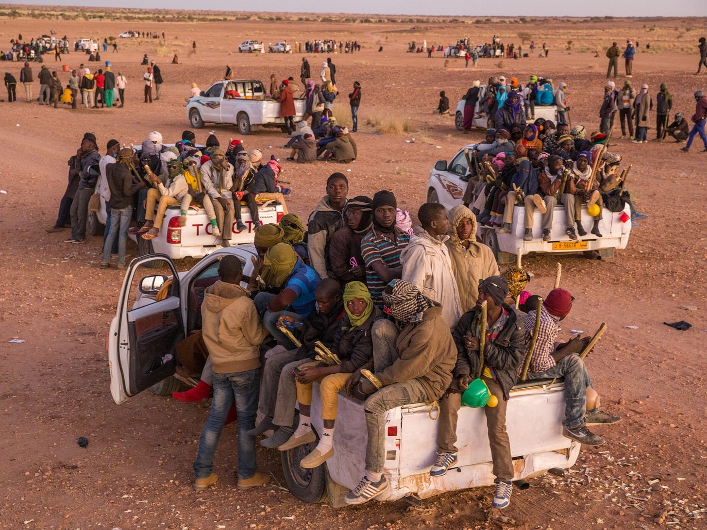 A National Geographic writer and photographer traveled hundreds of miles  through the desert, tracing the dangerous route migrants and others follow  to Libya.