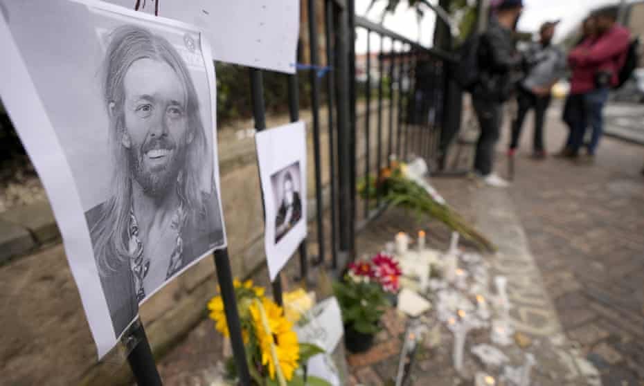 An image of Foo Fighters' drummer Taylor Hawkins adorns a makeshift memorial outside the hotel where he was found dead, in northern Bogota, Colombia