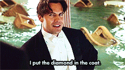 Gif from Titanic with the text "I put the diamond in the coat. And I put the coat on her!"