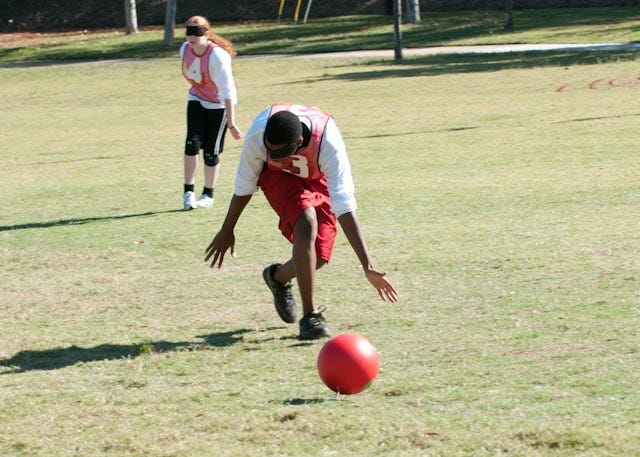 Child fielding a ball