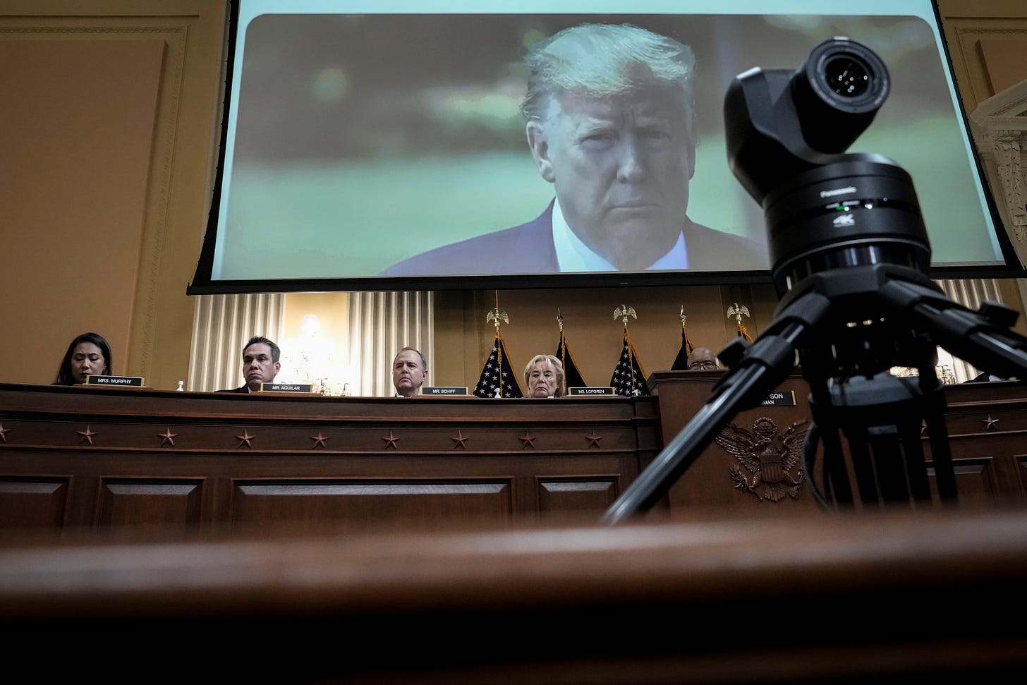  Former U.S. President Donald Trump is displayed on a screen during a hearing by the Select Committee to Investigate the January 6th Attack on the U.S. Capitol on June 9, 2022 in Washington, DC. (Photo by Drew Angerer/Getty Images).