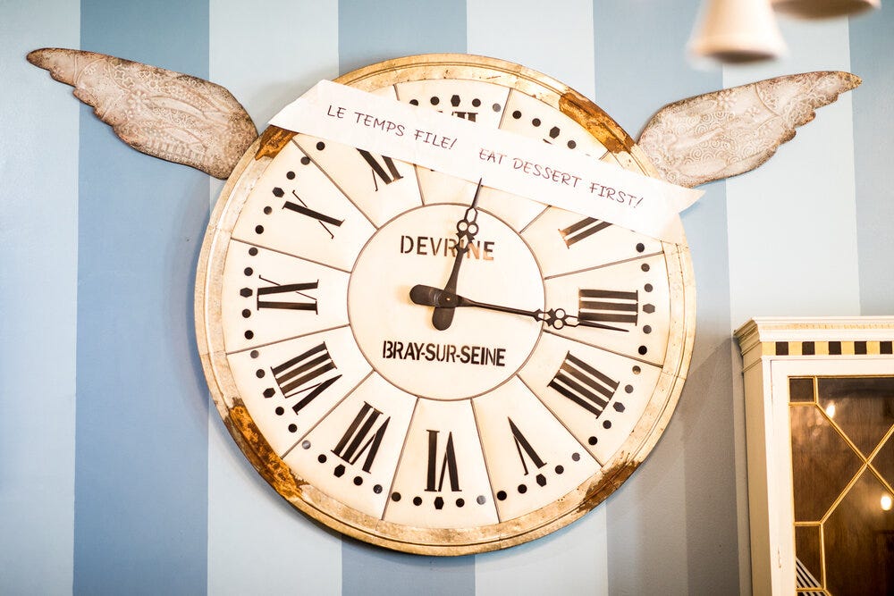 A large clock inside Amélie’s Bakery.