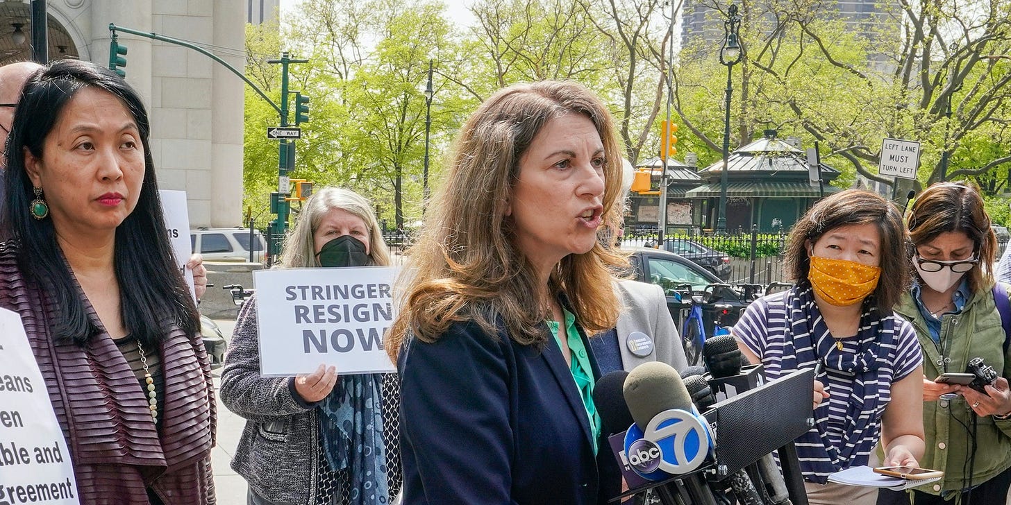 Jean Kim, left, listens as her attorney Patricia Pastor, center, speaks to reporters during a news conference, Wednesday, April 28, 2021, in New York.