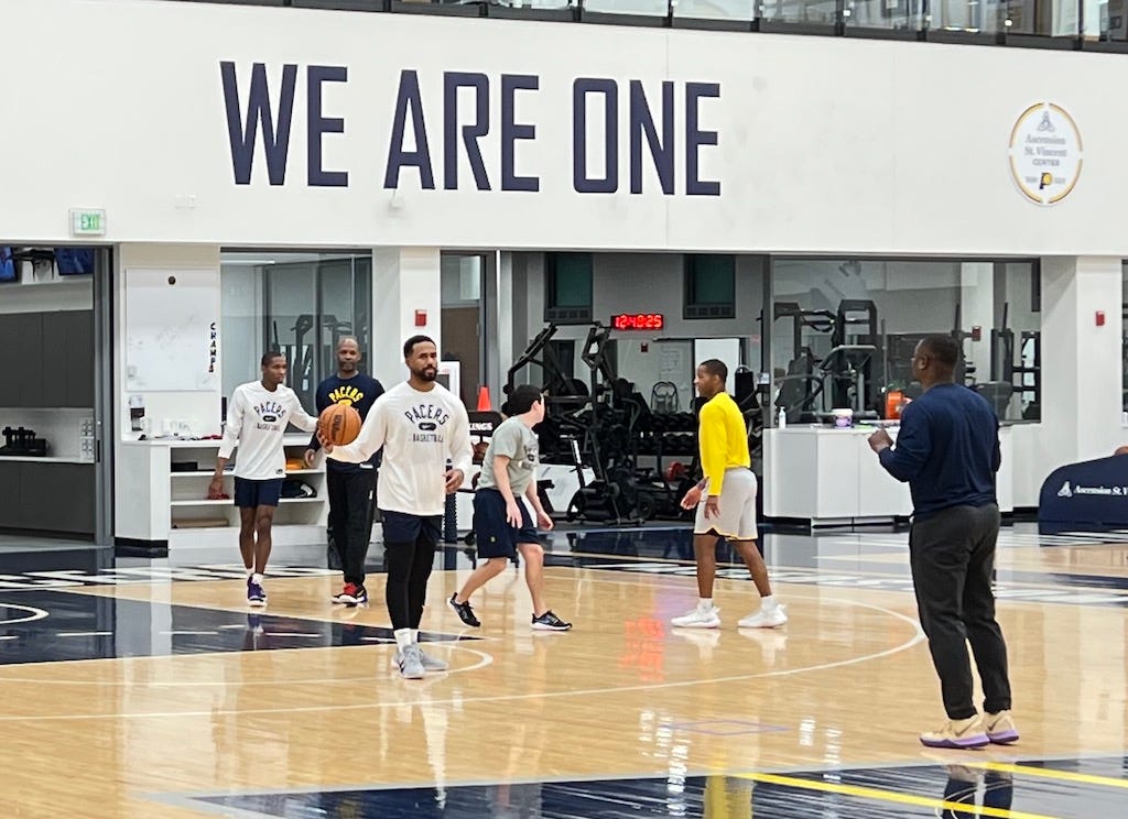 Noel Hightower (left) guards Calbert Cheaney as staffers scrimmage after a Pacers practice last season.