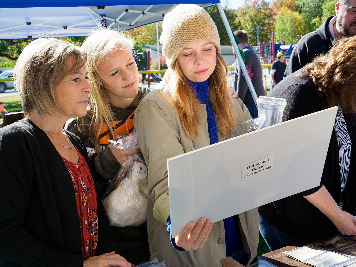 women looking at photo