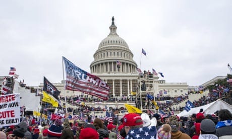 FILE - Rioters loyal to President Donald Trump rally at the U.S. Capitol in Washington on Jan. 6, 2021. Newly unsealed court documents show that a Tennessee man arrested for illegally entering the U.S. Capitol as part of a mob of supporters of Trump, also allegedly conspired with another person to kill dozens of federal agents involved in the investigation. Both men made their appearance in court on Friday, Dec. 16, 2022, in Knoxville, Tenn. (AP Photo/Jose Luis Magana, File)