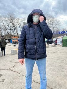 Alec Shevchenko, a 70-year-old Ukrainian refugee and former prosecutor from Kharkiv, kept on his surgical mask for the photo, out of fear of repercussions for expressing his views / credit: Fergie Chambers