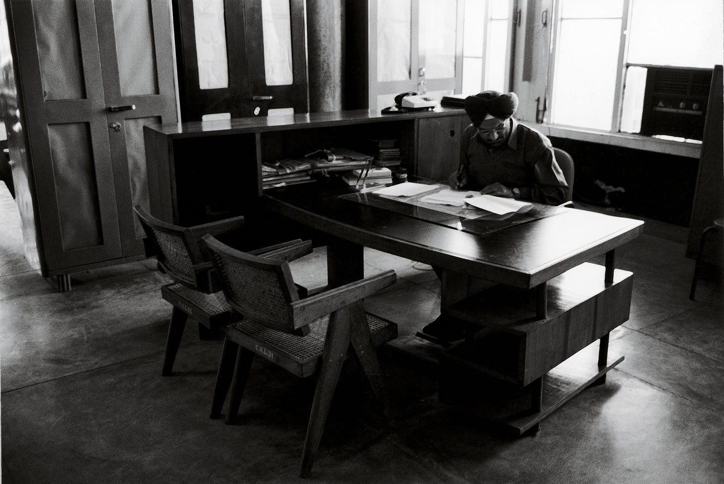 Image may contain Furniture Chair Tabletop Table Human Person Indoors Desk Room and Wood Image may contain Furniture Chair Tabletop Table Human Person Indoors Desk Room and Wood