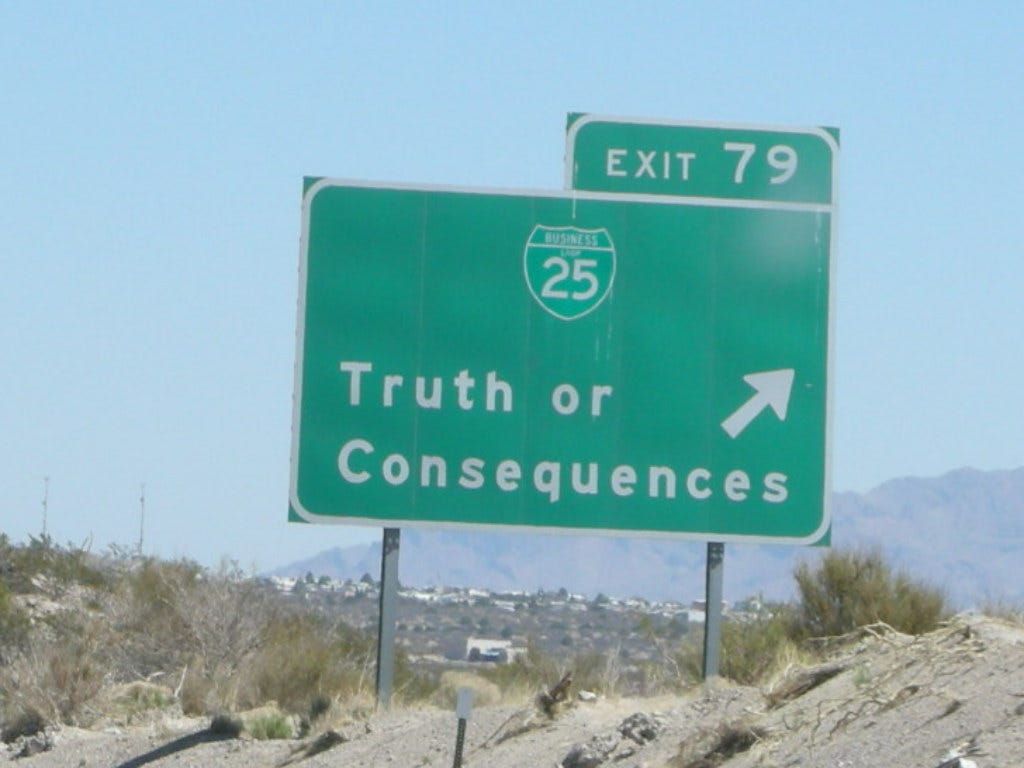 Road sign directing drivers towards Truth or Consequences, New Mexico.