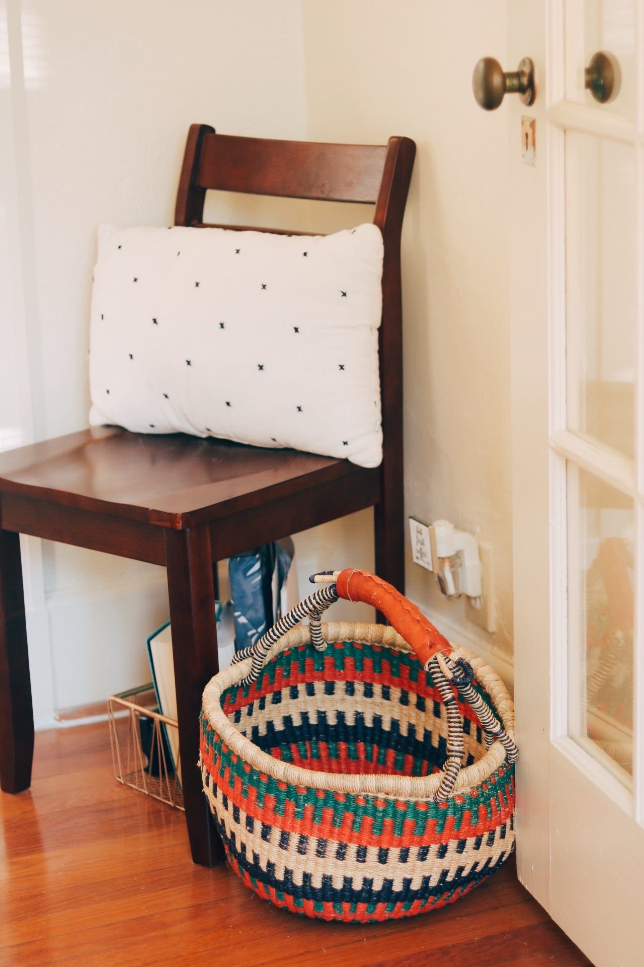  After you come in through the front door we have a bit of a second entryway that has a closet. The spaces are separated by this glass pane door.  My husband’s military gear is the current occupant of the closet. I wanted to spruce this place up a bi