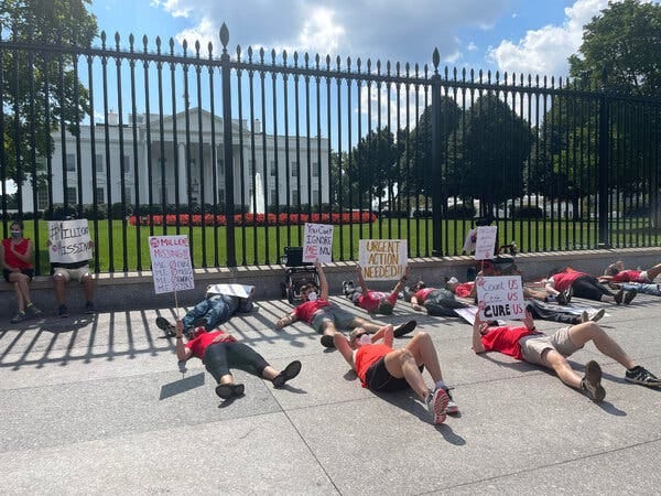 A protest in front of the White House demanding action on chronic fatigue syndrome and long Covid.