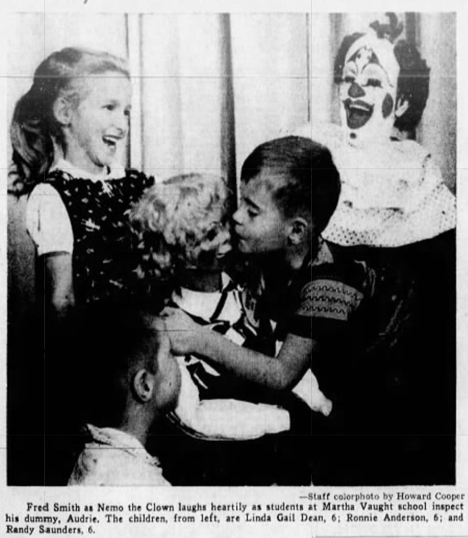 Newspaper clipping from 1957 illustrating children gathering around Nemo the Clown's toy dummy, with one boy kissing the dummy on the lips. All are joyful. 