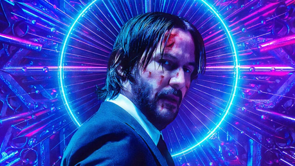 Keanu Reeves as John Wick with a few cuts and bruises on his face