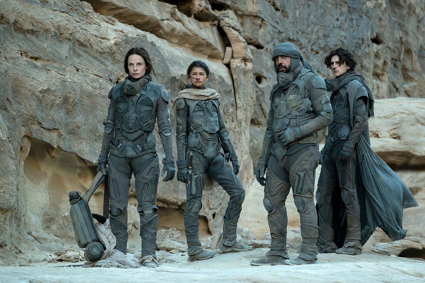 Rebecca Ferguson, Zendaya, Javier Bardem and Timothée Chalamet in stillsuits of the Fremen in Dune.