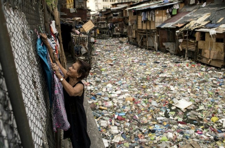 Manila &#39;trash bin&#39; waterway choked with plastic