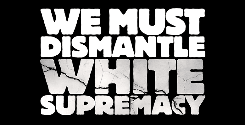 Banner reading "We must dismantle white supremacy"