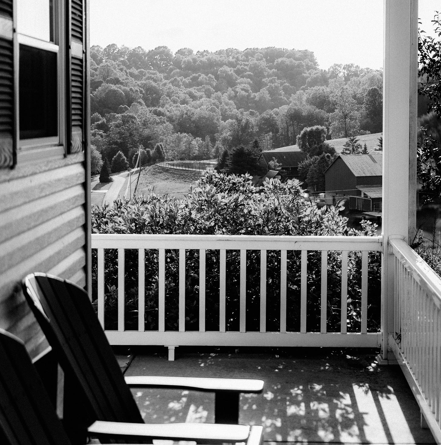 Black and White photo of a front porch with chairs