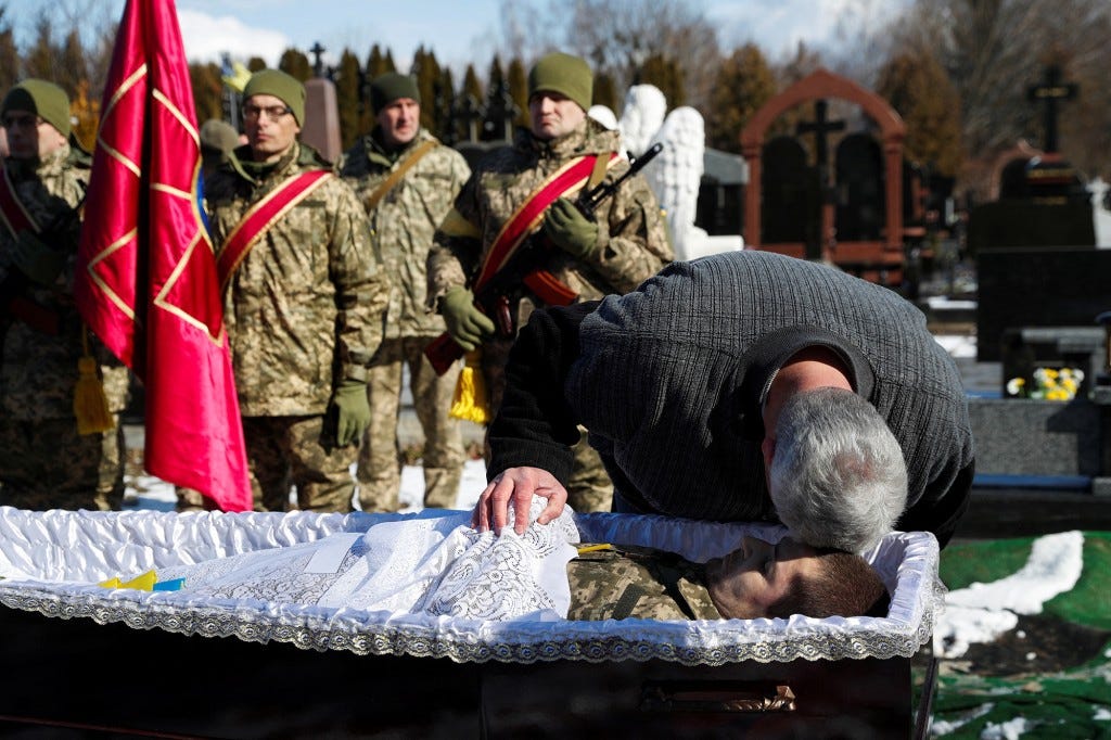 A joint funeral takes place at 'Saint's Peter and Paul Garrison Church', for two soldiers who died in the east of the country during recent fighting.