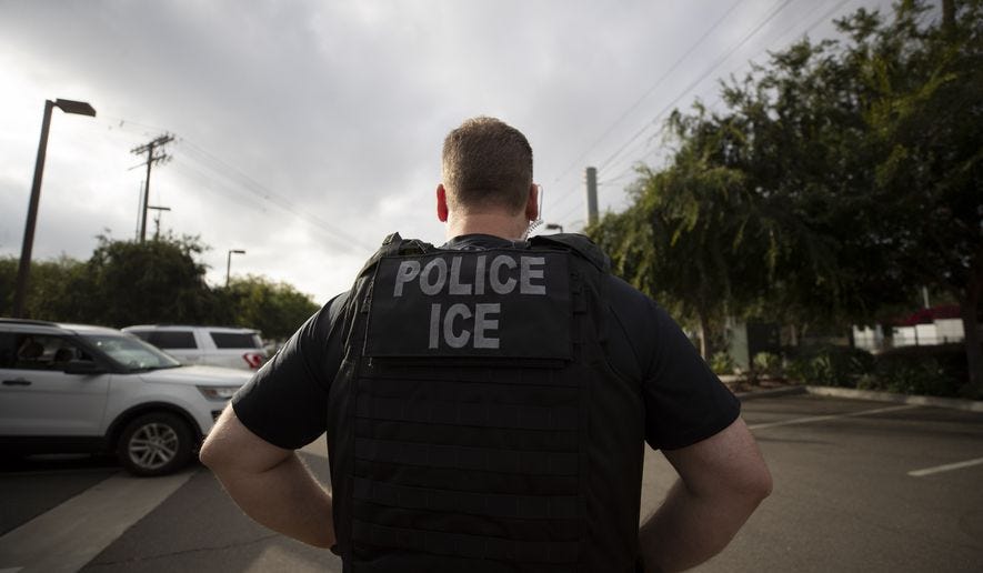 A U.S. Immigration and Customs Enforcement officer is shown in this file photo. (Associated Press)  **FILE**