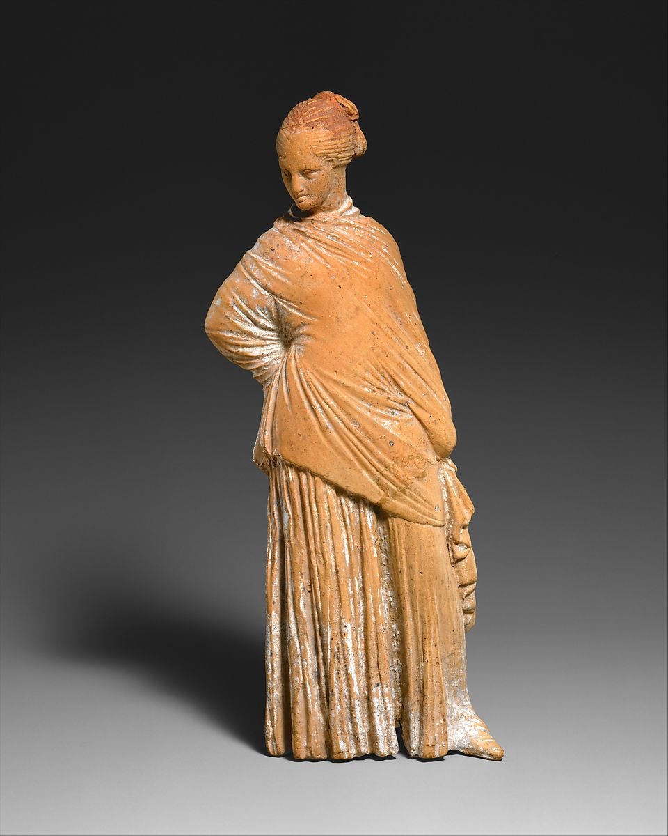 Terracotta statuette of a standing woman