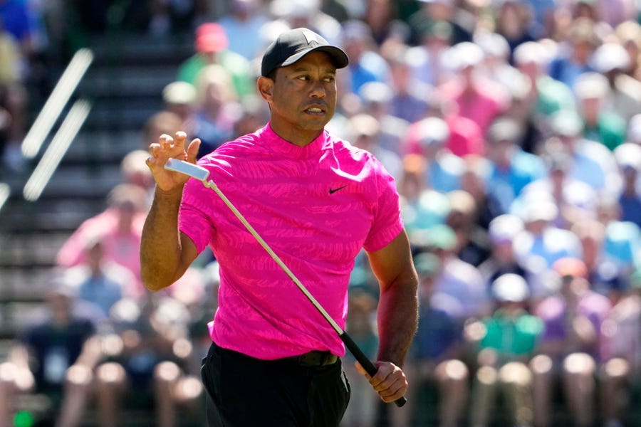 Tiger Woods reacts to his putt on the 15th green during the first round of the Masters.