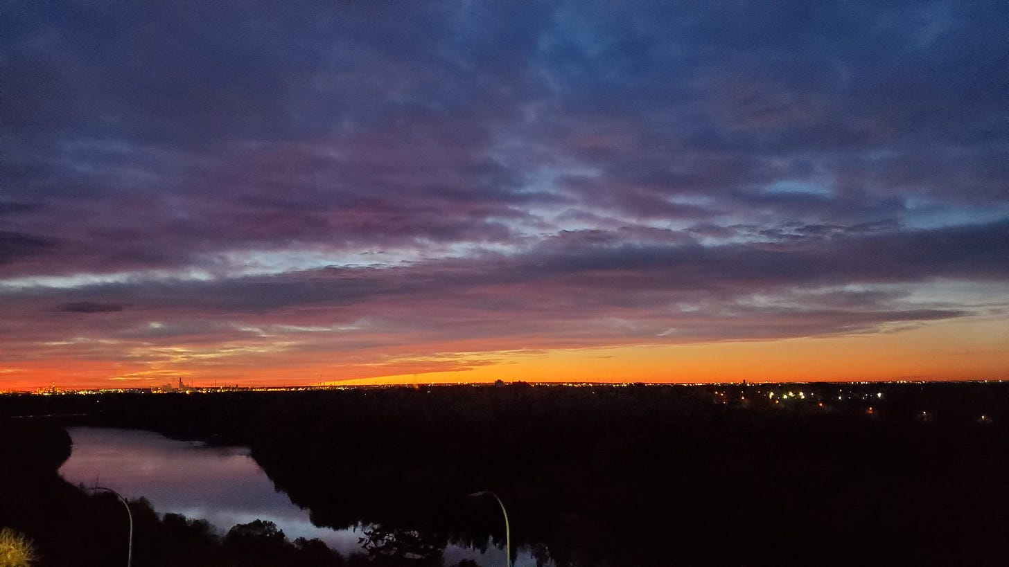 North Saskatchewan river at sunset with orange and blue sky