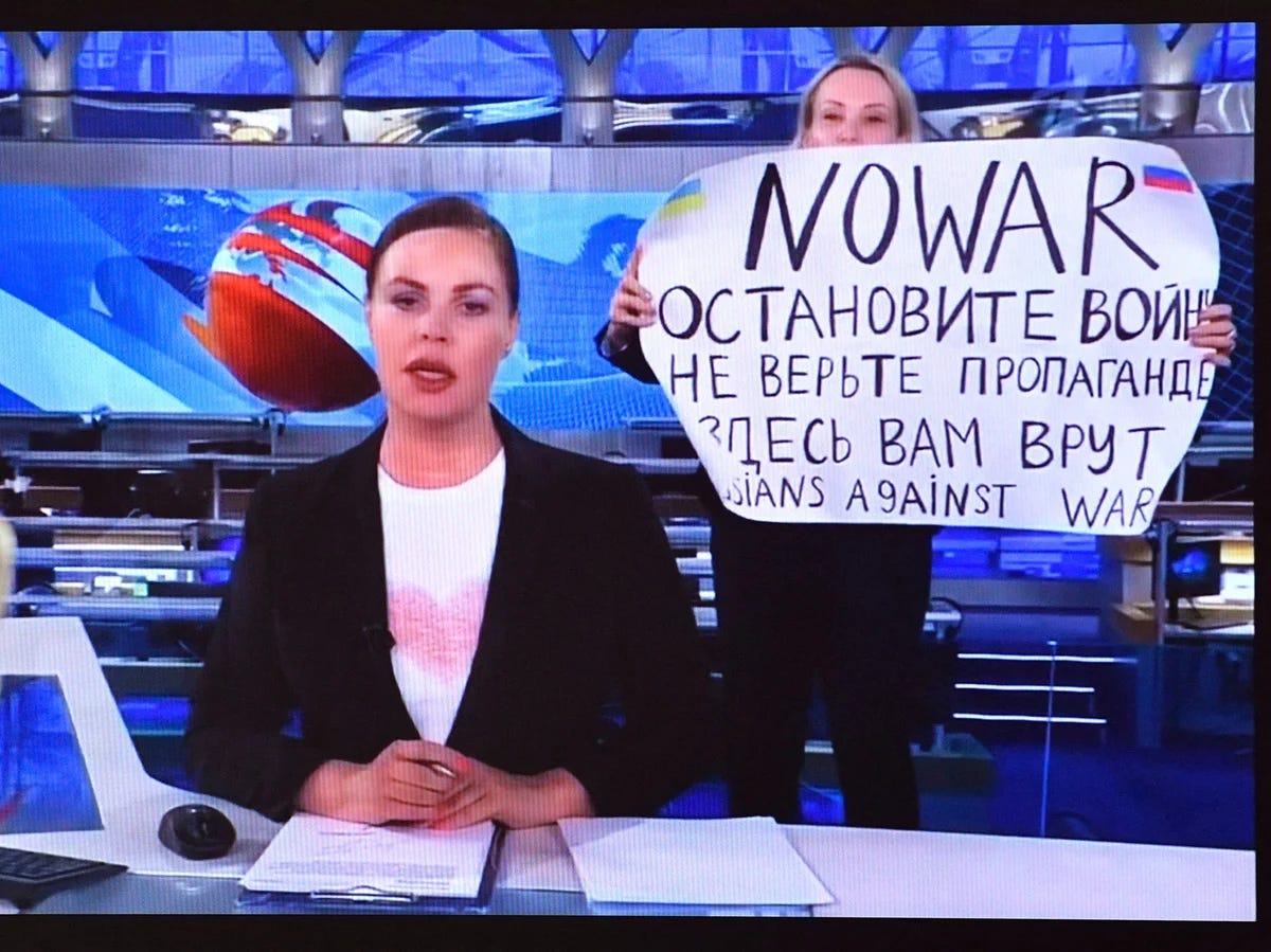Marina Ovsyannikova holds sign protesting war in Ukraine on Russia's Channel One TV