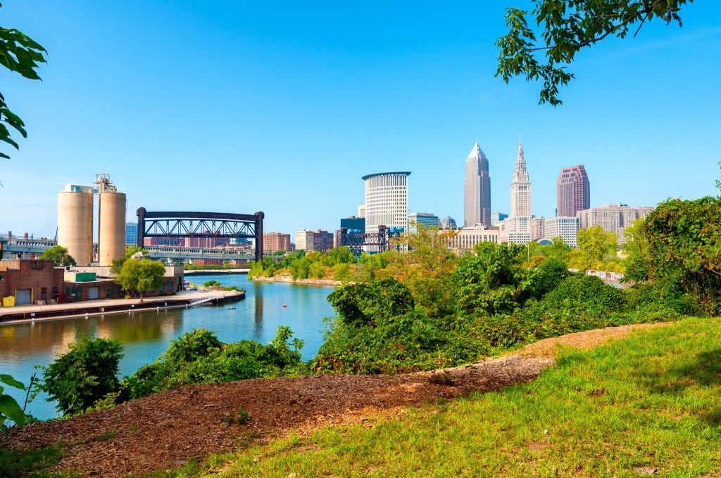 View of downtown Cleveland, Ohio, and the Cuyahoga River from a park on the west bank of the river.