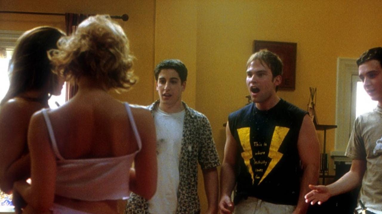 The boys of American Pie 2 standing in a room with two pretty women in their underwear. The boys look excited and horny!