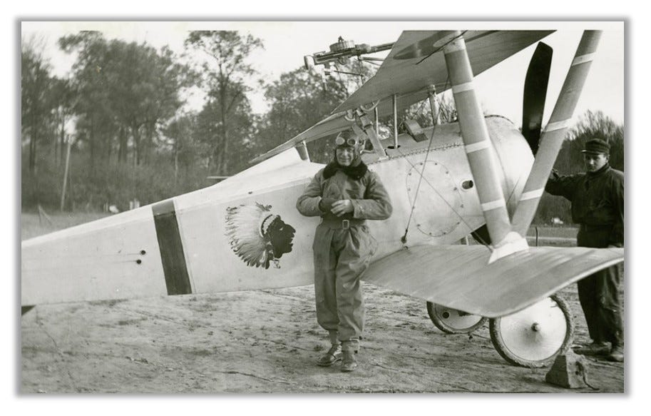 Robert Soubiran with his plane. He would have reached up from his cockpit to fire the wing-mounted gun. The Lafayette Escadrille logo is painted on the side of the airplane.