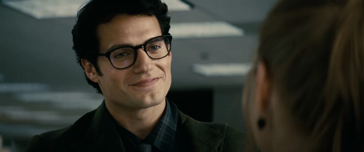 A shot from the ending sequence of 'Man of Steel'. Clark Kent smiles at Lois Lane, who has just welcomed him to "the planet."