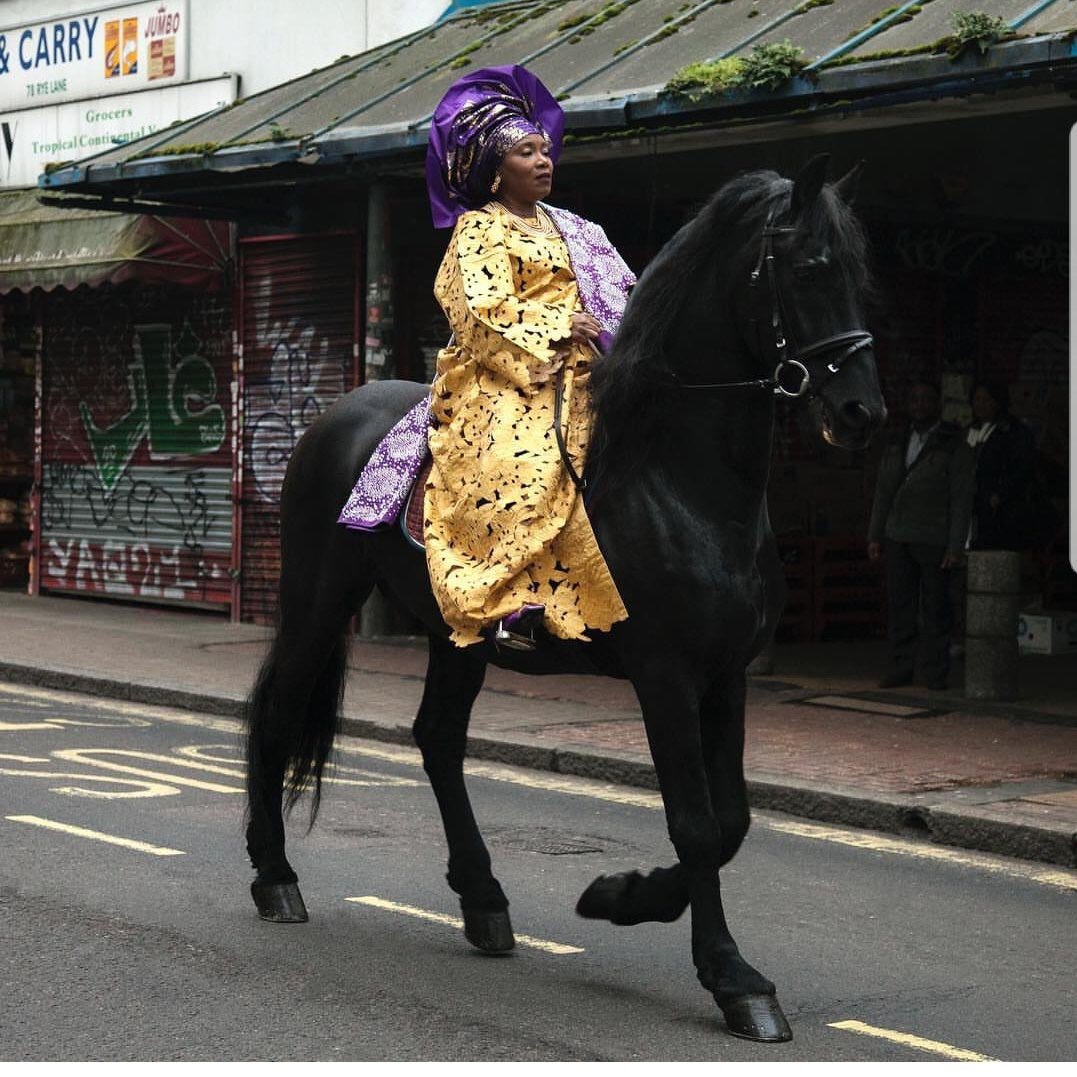 Woman in regalia on a horse