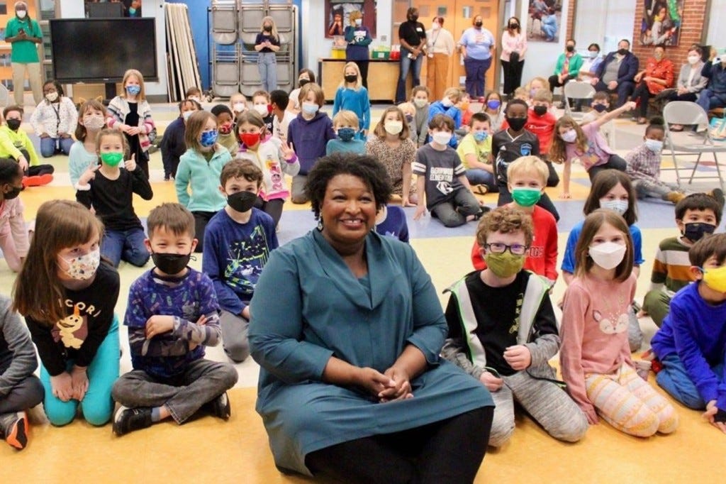 Stacey Abrams slammed for maskless pic surrounded by ...