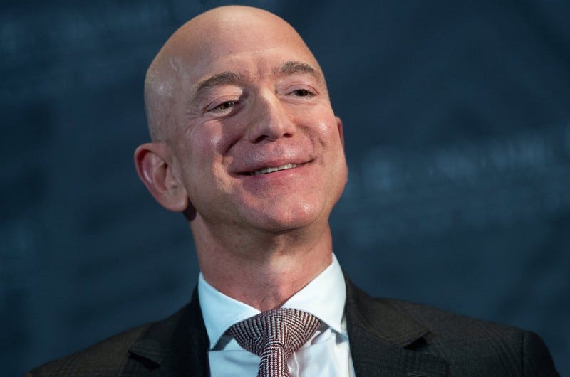 Amazon founder Jeff Bezos smiling smugly