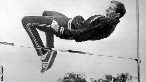 Richard Douglas &quot;Dick&quot; Fosbury revolutionized the high jump event when he  invented the &quot;back-first&quot; technique . - Jonathan Bluth