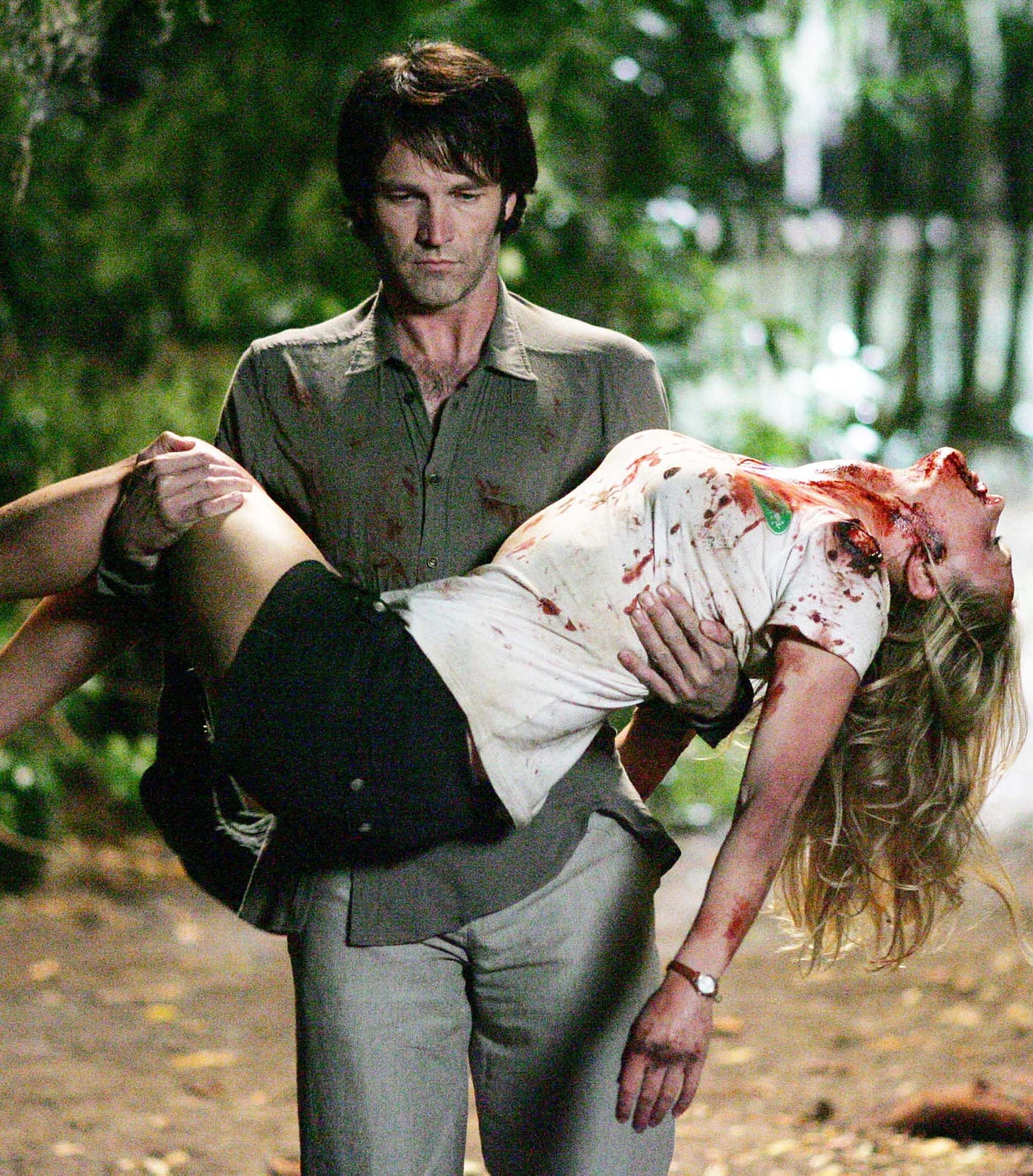 Bill Compton (Stephen Moyer) carries a bloody Sookie Stackhouse (Anna Paquin) in the pilot episode of HBO's True Blood