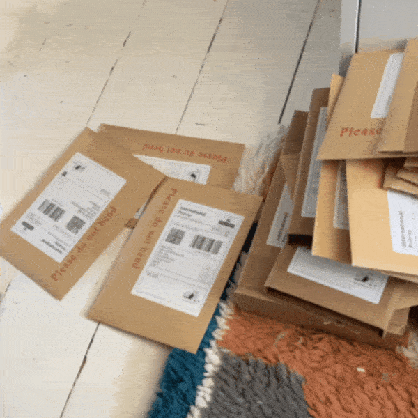 an animated gif showing lots of envelopes and packages