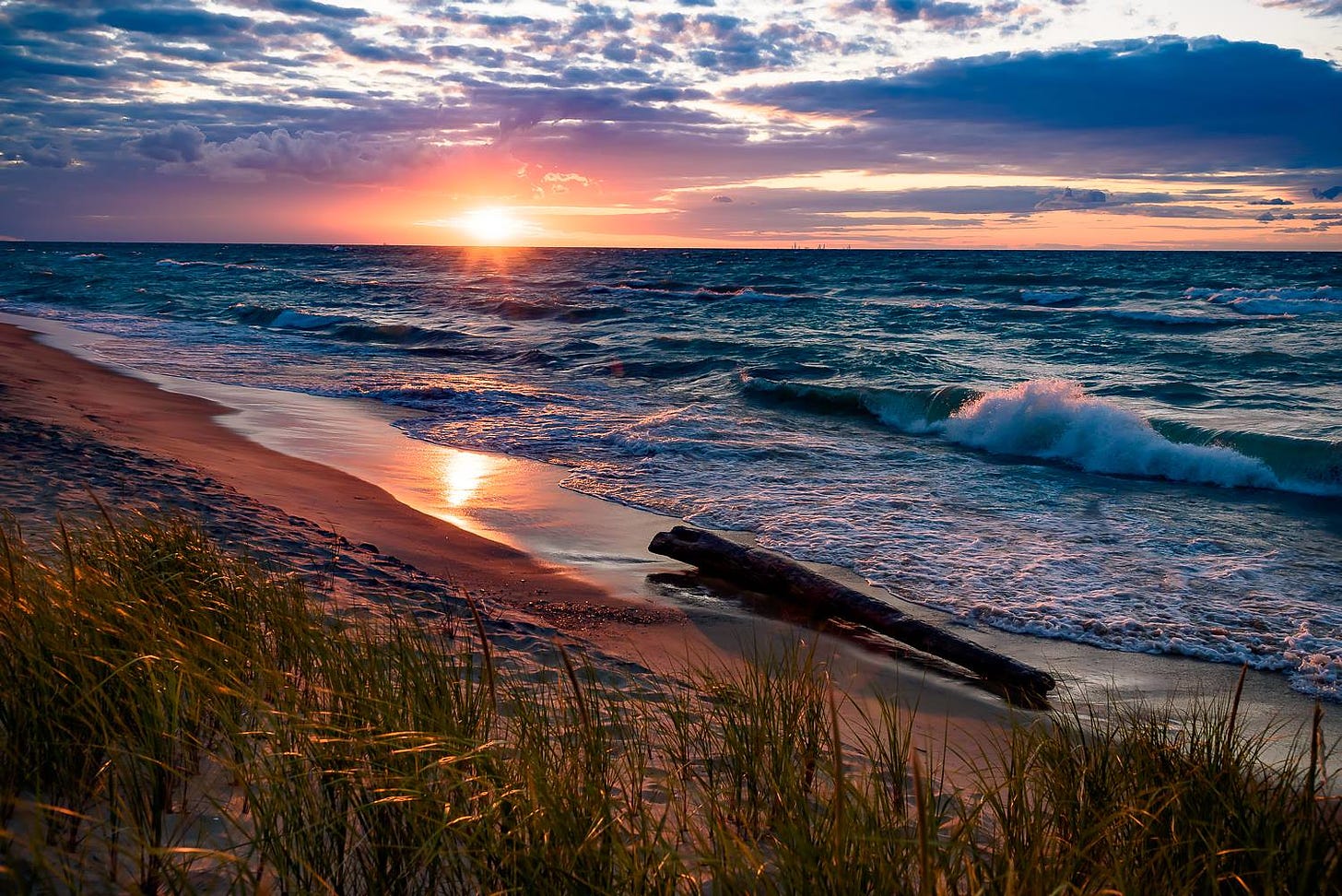 A photo of the sun setting over Lake Michigan.