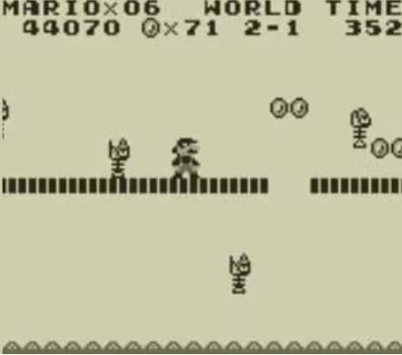 A screenshot from Super Mario Land, featuring sprites Nintendo had to increase in size for the 3DS re-release (shown here) in addition to the very basic looking... everything.