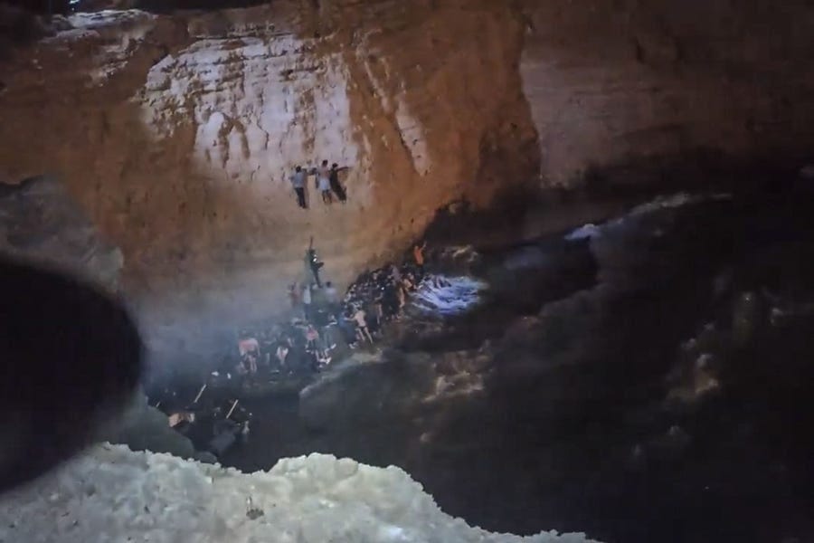 This screen grab from a video made available on October 6, 2022 by the Hellenic Coast Guard, shows the rescue of migrants from a shipwreck off the island of Cythera, south of the Peloponnese peninsula. There was no official toll yet from a second sinking south of the Peloponnese peninsula.