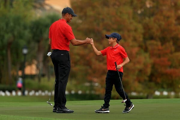 Tiger Woods and his son Charlie, now 12, fist bumped on the 18th hole during the final round of the PNC Championship last year.