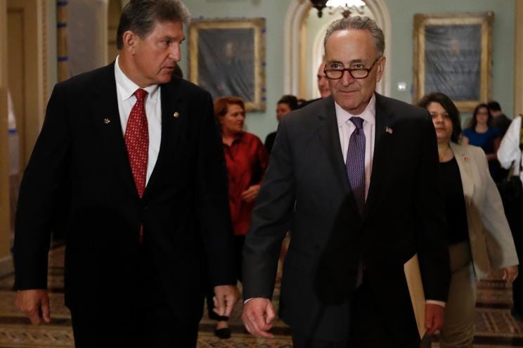 Sen. Joe Manchin, D-W.Va., left, and Senate Minority Leader Charles Schumer, D-N.Y. arrive for a news conference on Capitol Hill in Washington, Tuesday, May 2, 2017.