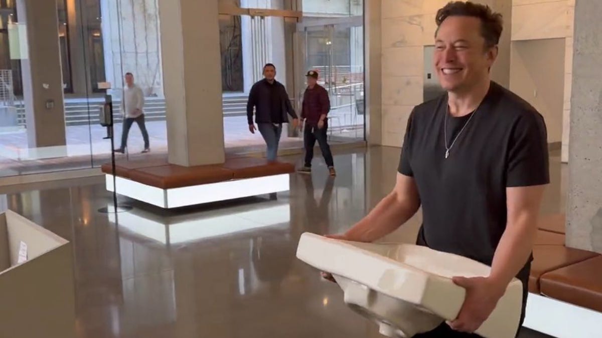 Elon Musk steps into Twitter HQ carrying sink, updates his bio to Chief ...