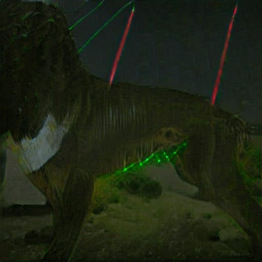 It might be some kind of boxer dog - its head is indistinct. In the background are red and green laser beams. There's green laser light on the dog's belly fur.